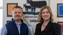 Dan Shike (left), professor and interim animal science department head at the University of Illinois Urbana–Champaign, and Kelli Retallick-Riley, president of AGI, pose as partnership representatives at the beef unit near the UIUC campus in March 2026. 