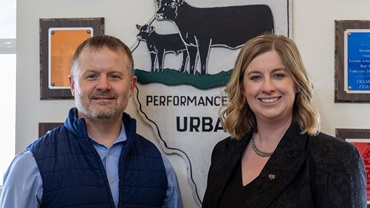 Dan Shike (left), professor and interim animal science department head at the University of Illinois Urbana–Champaign, and Kelli Retallick-Riley, president of AGI, pose as partnership representatives at the beef unit near the UIUC campus in March 2026. 