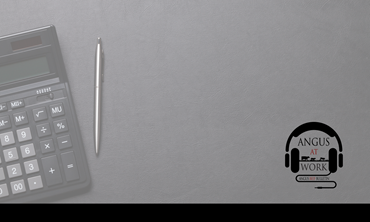 Pencil and calculator on desktop