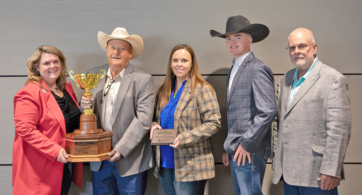 Colyer Herefords and Angus of Bruneau, Idaho, was named BIF Seedstock Producer of the Year. Pictured are (from left) Angie Denton, Drovers, award sponsor; Guy, Katie and Cruz Colyer, recipients; and Gordon Hodges, BIF president.  