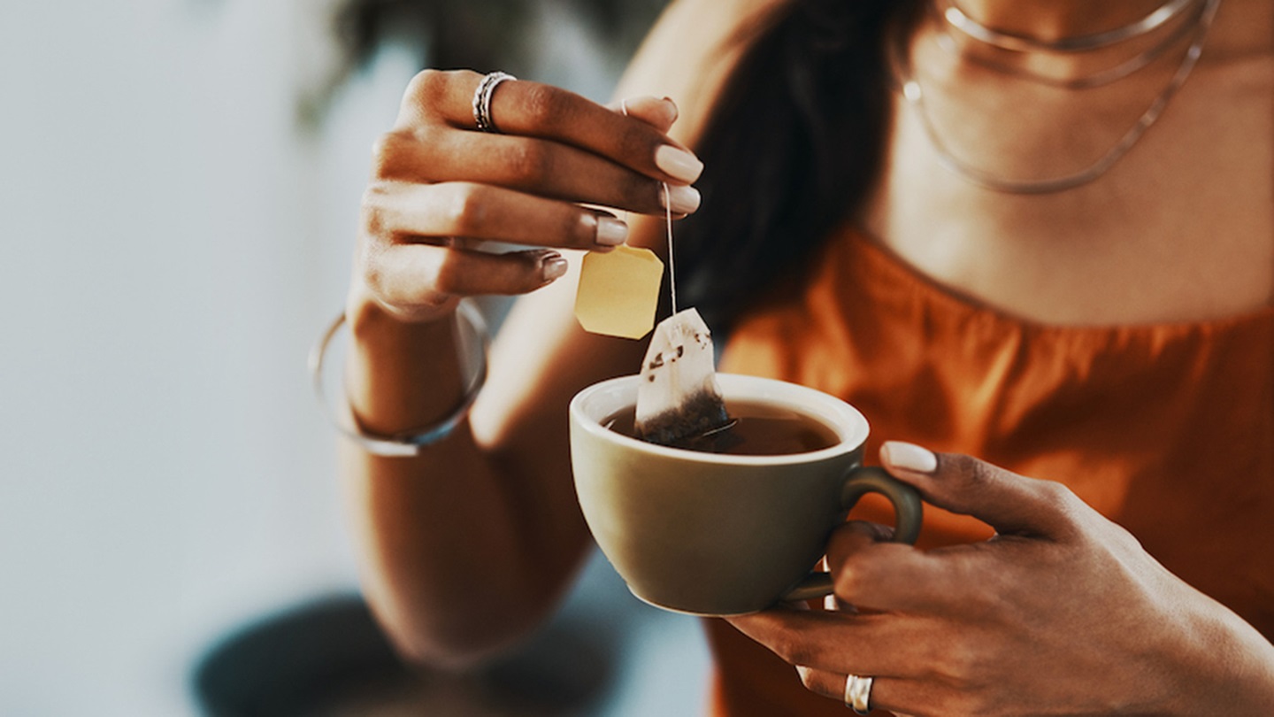 a person drinking tea