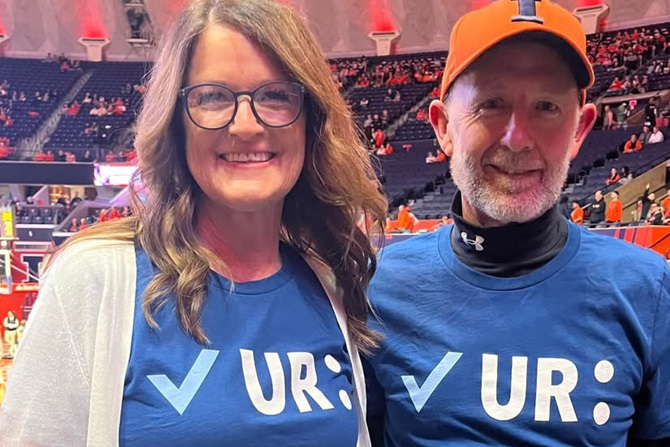 Scott and Cindy Anderson of Double Diamond Angus in Illinois stand in their "Check your colon" t-shirts in support of their late friend, Anne Dameron.