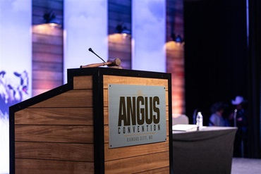 The Angus Convention podium stands on the front stage.