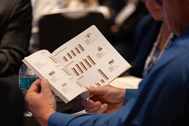 A member reviews the entity financials during the Annual Convention of Delegates.
