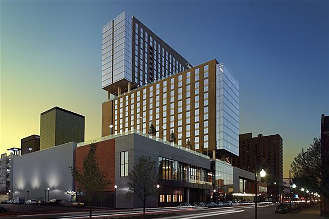The exterior of the Omni Hotel in Louisville, Kentucky, at twilight.