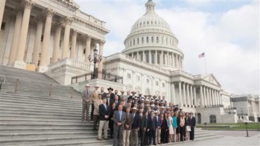 Group of attendees to the YCC conference on the steps of the U.S. Capitol