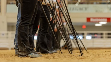 A lineup of the showmen's boots as they await to enter the ring.