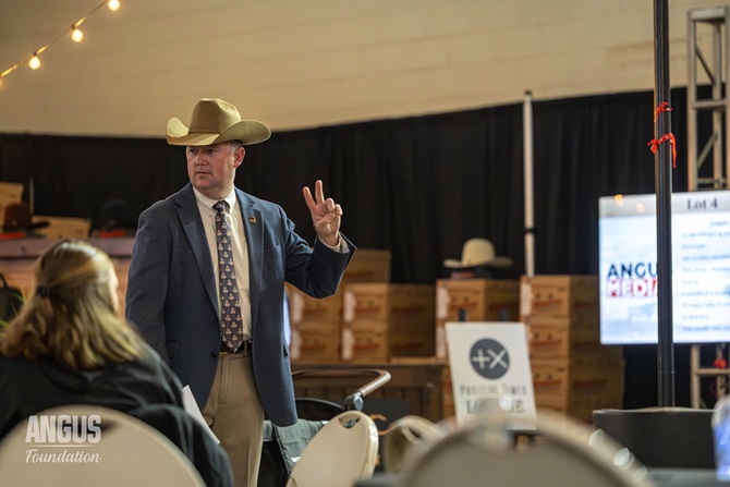 An Angus Regional Manager takes bids at the Angus Foundation silent auction held at the 2026 Cattlemen's Congress event.