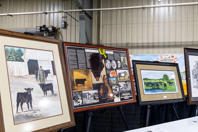  Multiple framed artwork pieces, featuring a vintage American Aberdeen Angus history timeline, was sold in the Angus Foundation Silent Auction at the 2025 NJAS event.