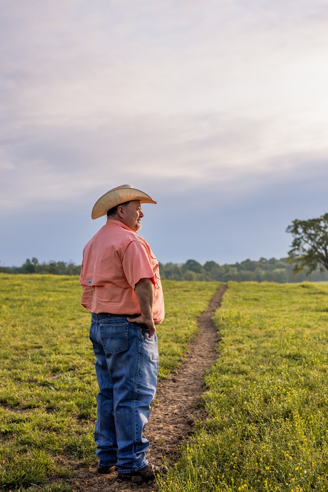 Jonathan Perry looking out on his land