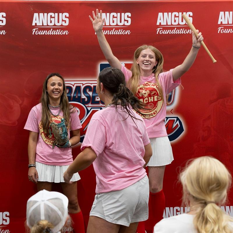 Missouri Senior Steak team members Ella Coulter (right) and Clara Wallace (left) cheer for the winning at-bat as part of their skit during the judging of the All-American Certified Angus Beef® Cook-Off held in Louisville, Kentucky.