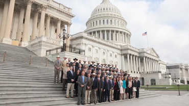 A group of YCC attendees standing on the steps of the capital in Washington, D.C.