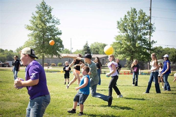 NJAA members playing dodgeball outside together.