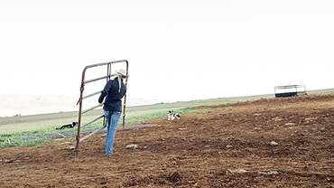 women moving a gate
