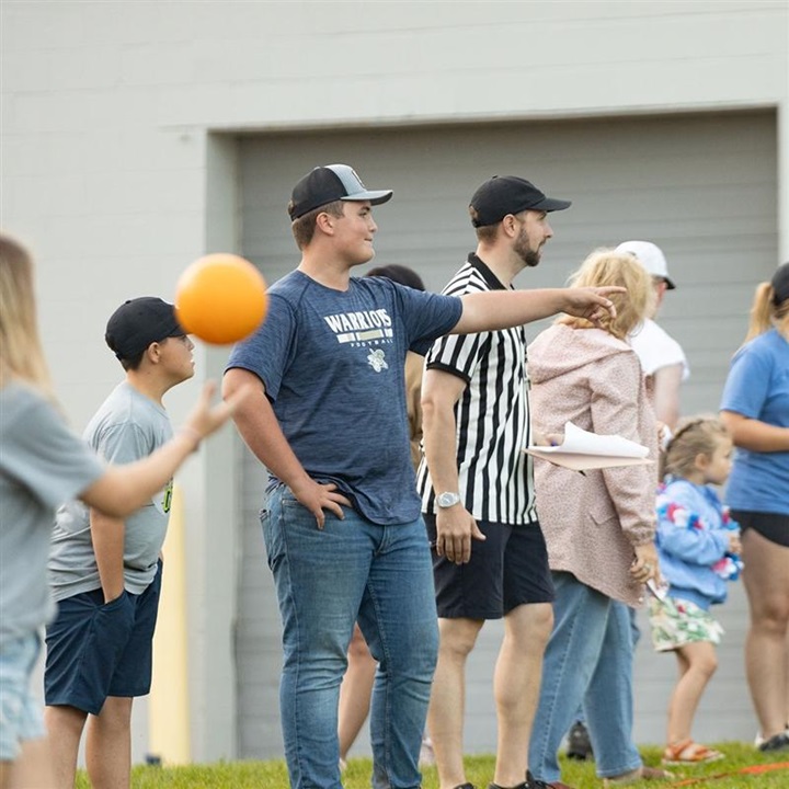 Group of NJAA members pointing at one another while playing a game of dodgeball.