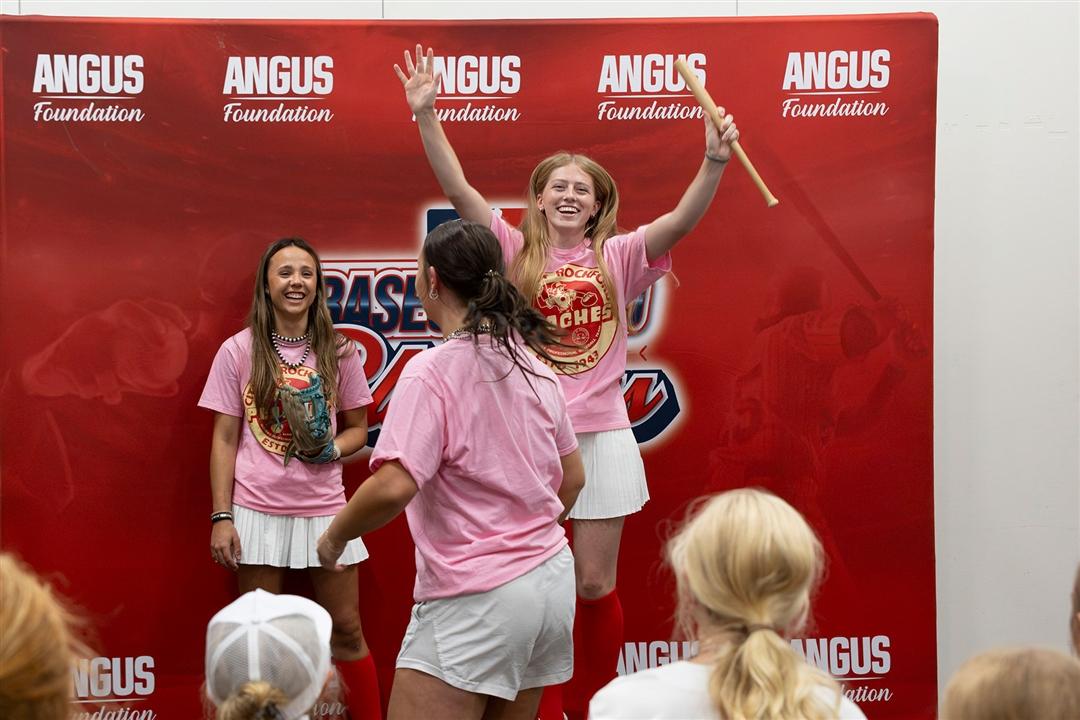 Missouri Senior Steak team members Ella Coulter (right) and Clara Wallace (left) cheer for the winning at-bat as part of their skit during the judging of the All-American Certified Angus Beef® Cook-Off held in Louisville, Kentucky.