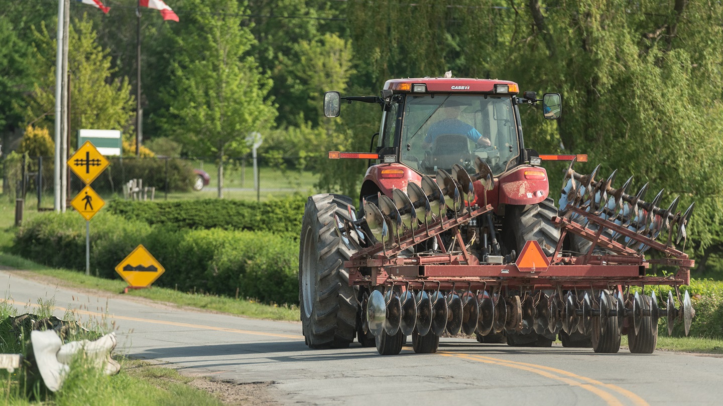 farm implement on highway