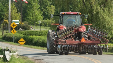 farm implement on highway