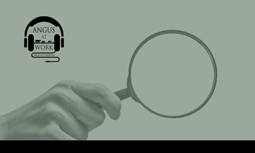 Hand holding magnifying glass