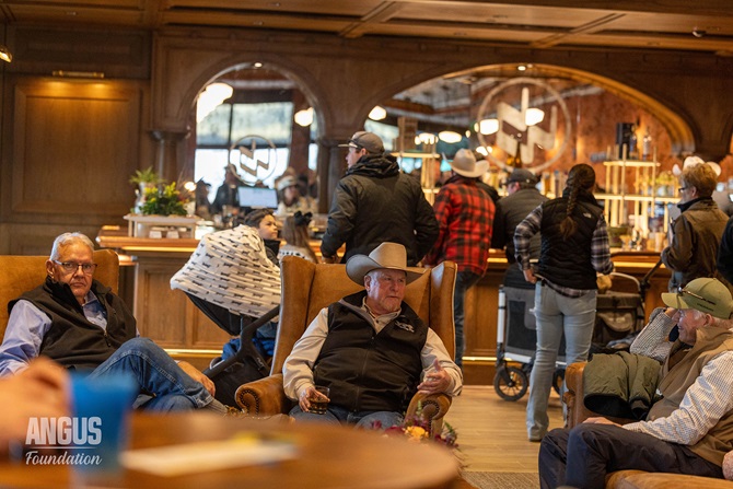 Angus herdsman sit and fellowship at the 2026 Angus Herdsman social at the NWSS event.