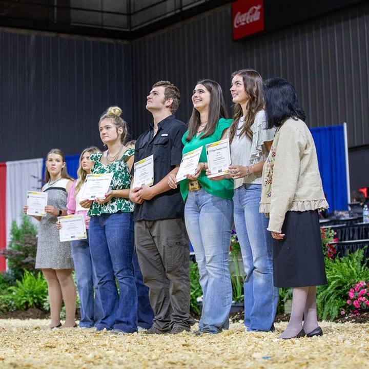 A group of NJAA members standing together after receiving a scholarship award.