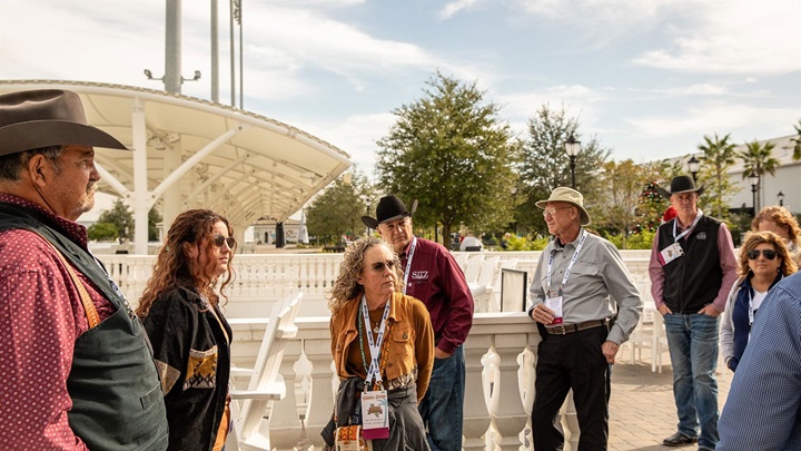 A group of Angus Convention attendees on an industry tour at a location in Florida.