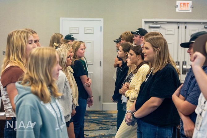 Participants facing one another during an interactive activity.