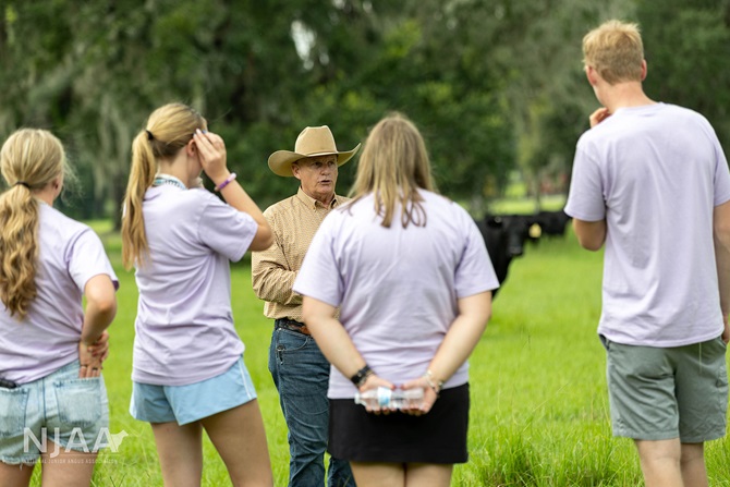 Group of NJAA participants listening during a ranch tour.