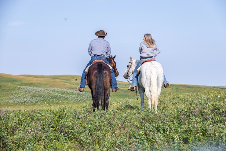 two people on horseback