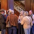 A group of breeders stand and chat.