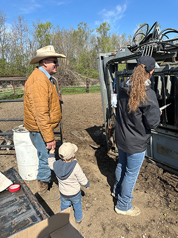 The long-standing working relationship between Ross Wientjes (left) and veterinarian Holly Roe-Johnson has developed into a firm friendship between both families, including Ross’s grandson Wilder.