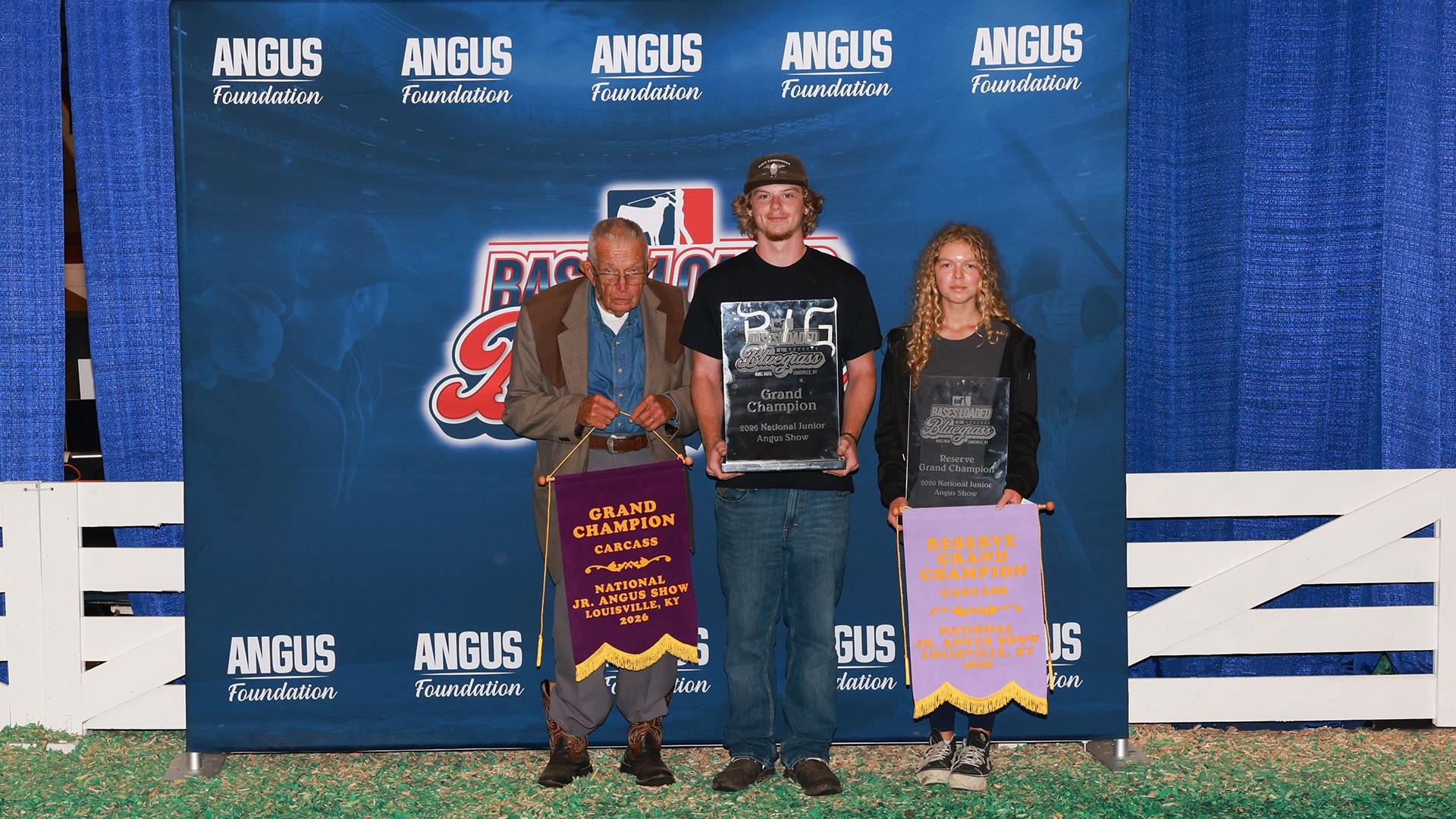  L-R: Dr. Curtis Long of Butler, Mo. Presents an award to Owen Austrino of Dade City, Fla., Grand Champion Carcass and Zoe Gurley of Sarcoxie, Mo., Reserve Grand Champion Carcass at the 2026 National Junior Angus Show in Louisville, Ky.