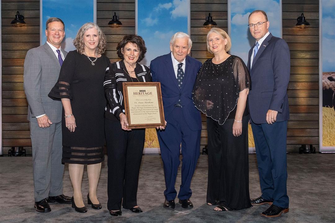 Dr. David Hawkins, Mason, Michigan, was inducted into the Angus Heritage Foundation at the 2025 Angus Convention on Nov. 1.    Pictured from left are Dan and Lisa Moser, son-in-law and daughter; Kathleen Hawkins, wife; Dr. David Hawkins; Jennifer Hawkins, daughter; and Mark McCully, American Angus Association CEO.  
