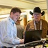 An industry showcase sponsor speaks with an Angus Convention attendee.