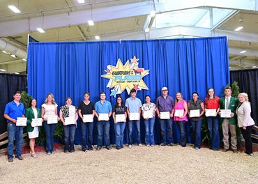 Group of Talon scholars holding awards certificates.