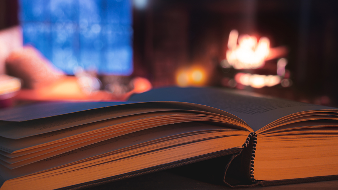 book with fire in the background