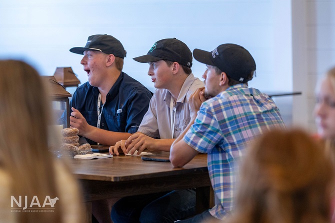 Participants listening during a discussion at Southern Hill Farms.