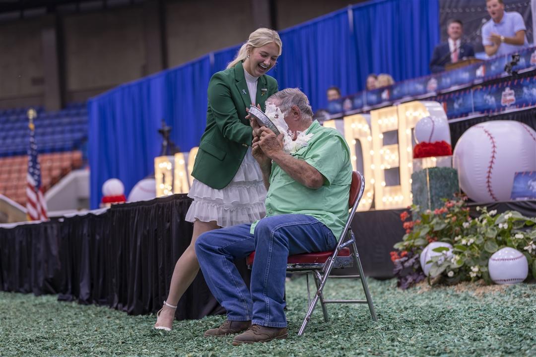 Laughter filled the arena as Gary Dameron received a pie to the face after winning the National Junior Angus Association's Penny Wars fundraiser during the National Junior Angus Show in Louisville, Kentucky. Throughout the week, juniors raised more than $11,000 for the Colon Cancer Foundation.