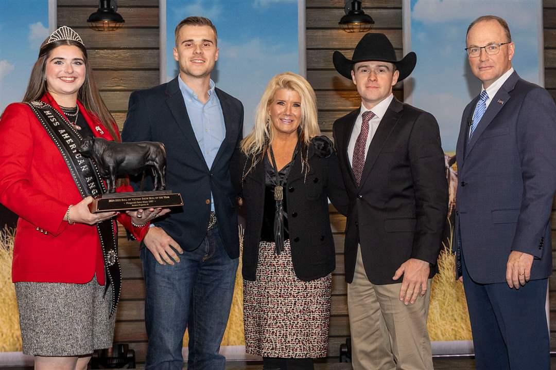FITZGERALD Saint Elmo 1997 owned by Broderic Fitzgerald of Frankfort, Indiana, was named ROV Show Bull of the Year at the 2025 Angus Convention Awards Dinner in Kansas City, Missouri. Pictured from left are Miss American Angus Rosalind Kidwell; Broderic’s brother, Bryce Fitzgerald, his mom Andi Clock Fitzgerald and Broderic Fitzgerald and Mark McCully, American Angus Association CEO. 