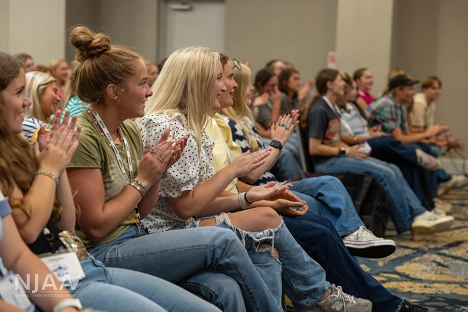 NJAA participants applauding during a leadership event.