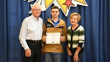 Boy getting NJAS scholarship