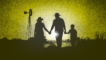 Family walking into ag sunset