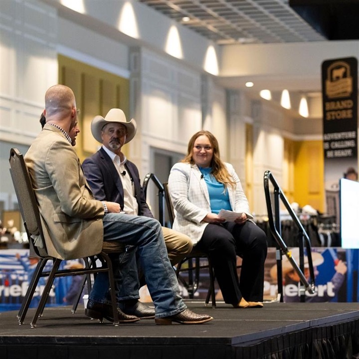 A group of panelists discussing a topic during a session at Angus Convention.