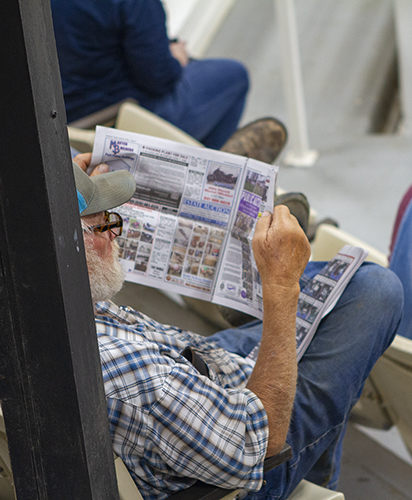 guy reading a newspaper