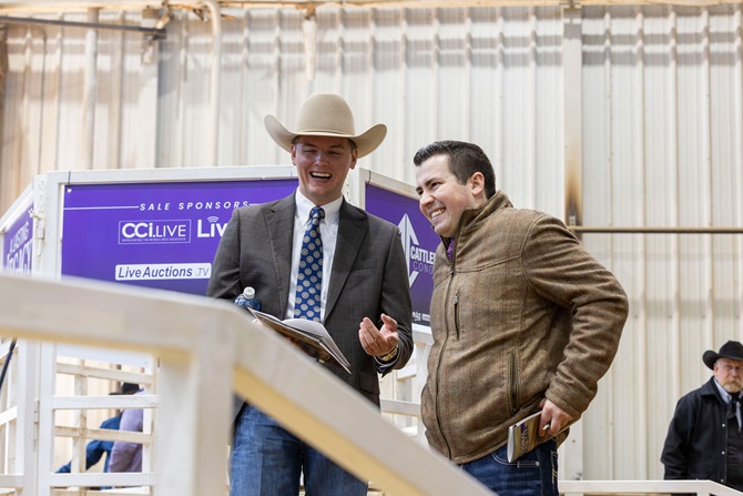 Jimmy Stickley of the Angus Foundation smiles as he communicates with a potential buyer at the 2026 Angus Foundation Heifer Package sale.