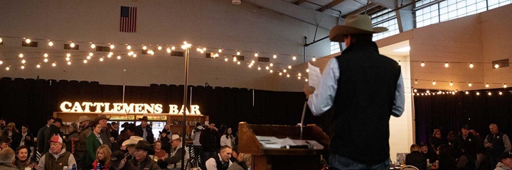 Speaker in front of a large room.