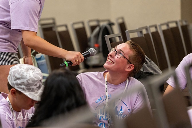 Participant answering a question during a group activity.