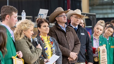 Jaclyn Boester, Angus Foundation executive director, introduces the 2024 Angus Foundation Heifer Package donor, Yon Family Farms of Ridge Spring, S.C., at the 2024 National Angus Bull Sale in Oklahoma City. The month of January brings many ways to support the Angus Foundation, including the 2025 heifer package donated by Pollard Farms of Waukomis, Oklahoma.
