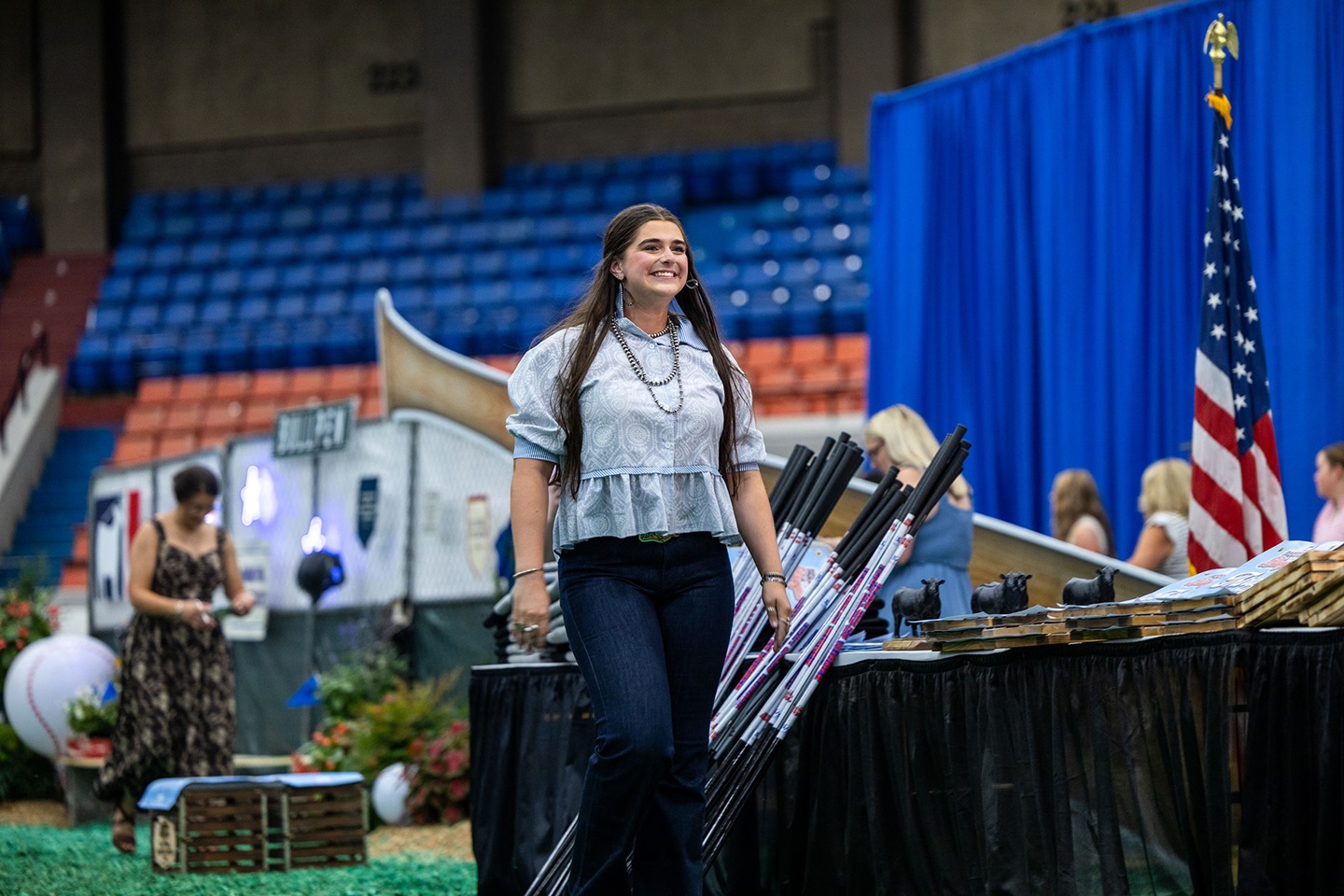 With a smile, Rosalind Kidwell of Gentryville, Indiana is recognized during the closing awards ceremony at the National Junior Angus Show in Tulsa, Oklahoma, marking the culmination of hard work and dedication throughout her junior career. 