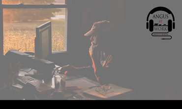 Man in office at computer. 